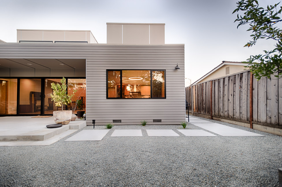  House featuring raised roof areas 
